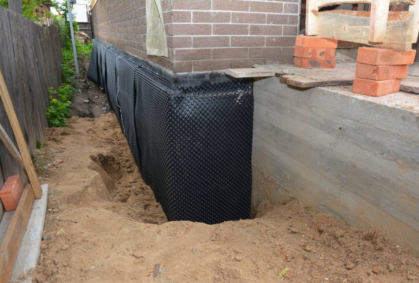 SJ Waterproofing Pros technician performing targeted Emergency Waterproofing assessment in Milton Center, OH
